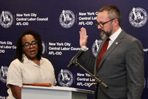 Brendan Griffith sworn in as NYC CLC President by Secretary Treasurer Janella T. Hinds